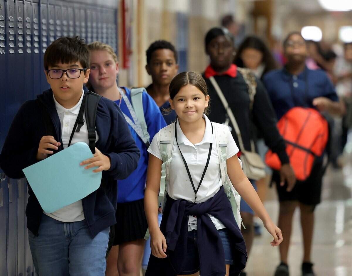 Students at William Monnig Middle School transition to their next class on Friday, Aug. 14, 2026, in Fort Worth. The school is part of the Elevate Network.